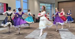 group of ballerinas in costume dancing The Nutcracker performance.