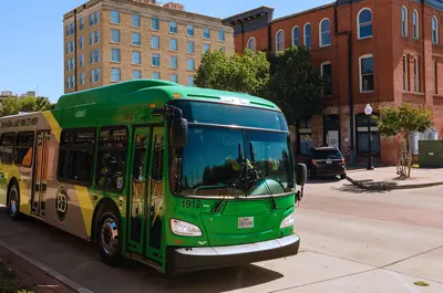 Brazos Transit District bus driving in downtown Bryan