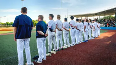 Bryan Yard Dogs team lined up in honor of the national anthem