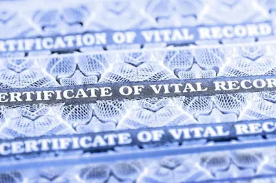 stack of official documents: Certificates of Vital Records