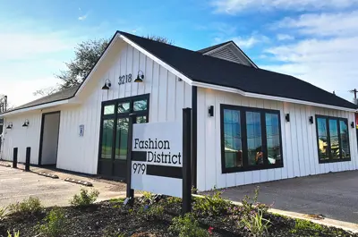 example building recipient of a Development Services grant, displaying a new polished exterior and clean landscaping