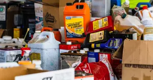 collection of bottled hazardous waste products and chemicals piled up.