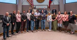 Development Services and Planning employees group photo showcasing the award trophy.