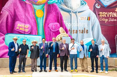 sponsors, councilmembers, and mural artist group photo in front of the new mural