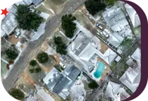 aerial view of a neighborhood covered in frost