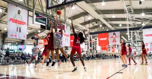 girls basketball team playing during Adidas event in Legends Event Center
