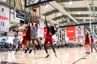 girls basketball team playing during Adidas event in Legends Event Center