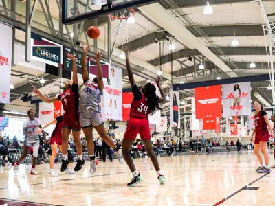 girls basketball team playing during Adidas event in Legends Event Center