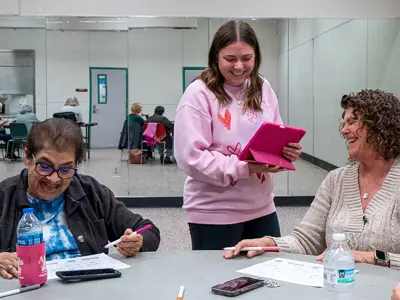 Parks & Recreation laughing with seniors during a social activity session