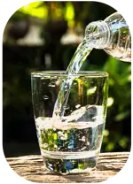 pouring drinking water into a glass