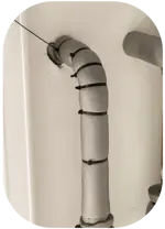 wrapped pipe coming out of a wall to insulate and protect from freezing