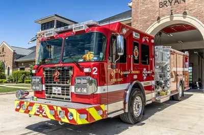 view from the front and side of a new fire truck delivered to the Bryan Fire Department