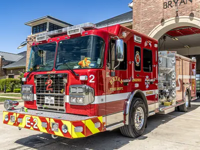 view from the front and side of a new fire truck delivered to the Bryan Fire Department