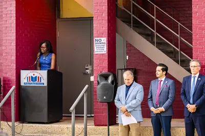 library director, sponsor, City of Bryan councilmember and Chamber of Commerce standing to announce the unveiling