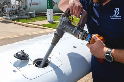 City of Bryan staff refueling an aircraft