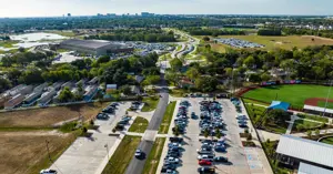 Aerial view of the street that runs by Travis Major Field, leading into Bryan Midtown Park