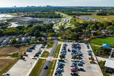 Aerial view of the street that runs by Travis Major Field, leading into Bryan Midtown Park