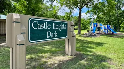 Castle Heights Park sign with park in the background