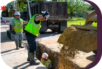 city employees repairing a main water pipe
