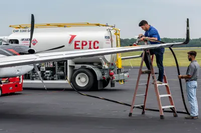 staff filling an aircraft at the fueling station