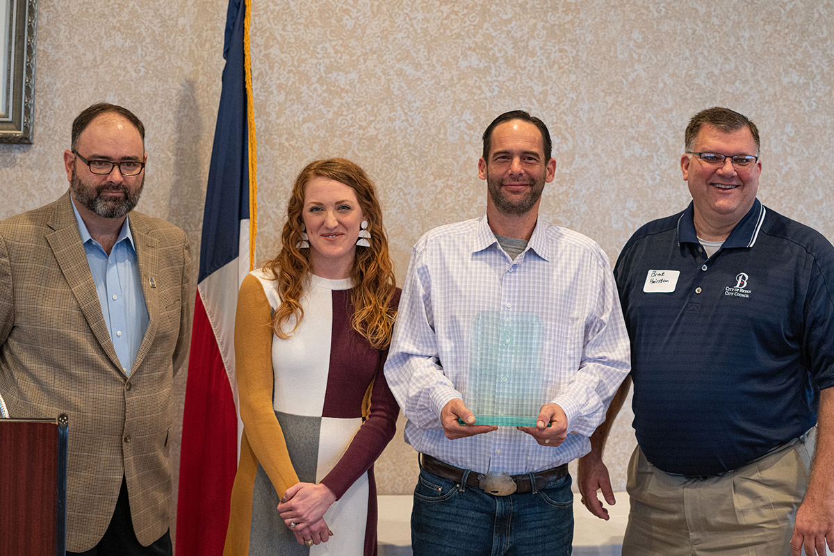 From left, Mayor Pro Tem Greg Owens, Amanda Light, Brian Light, and Councilmember Brent Hairston. The Lights were awarded the 2019 Mayor's Downtown Impact Award.