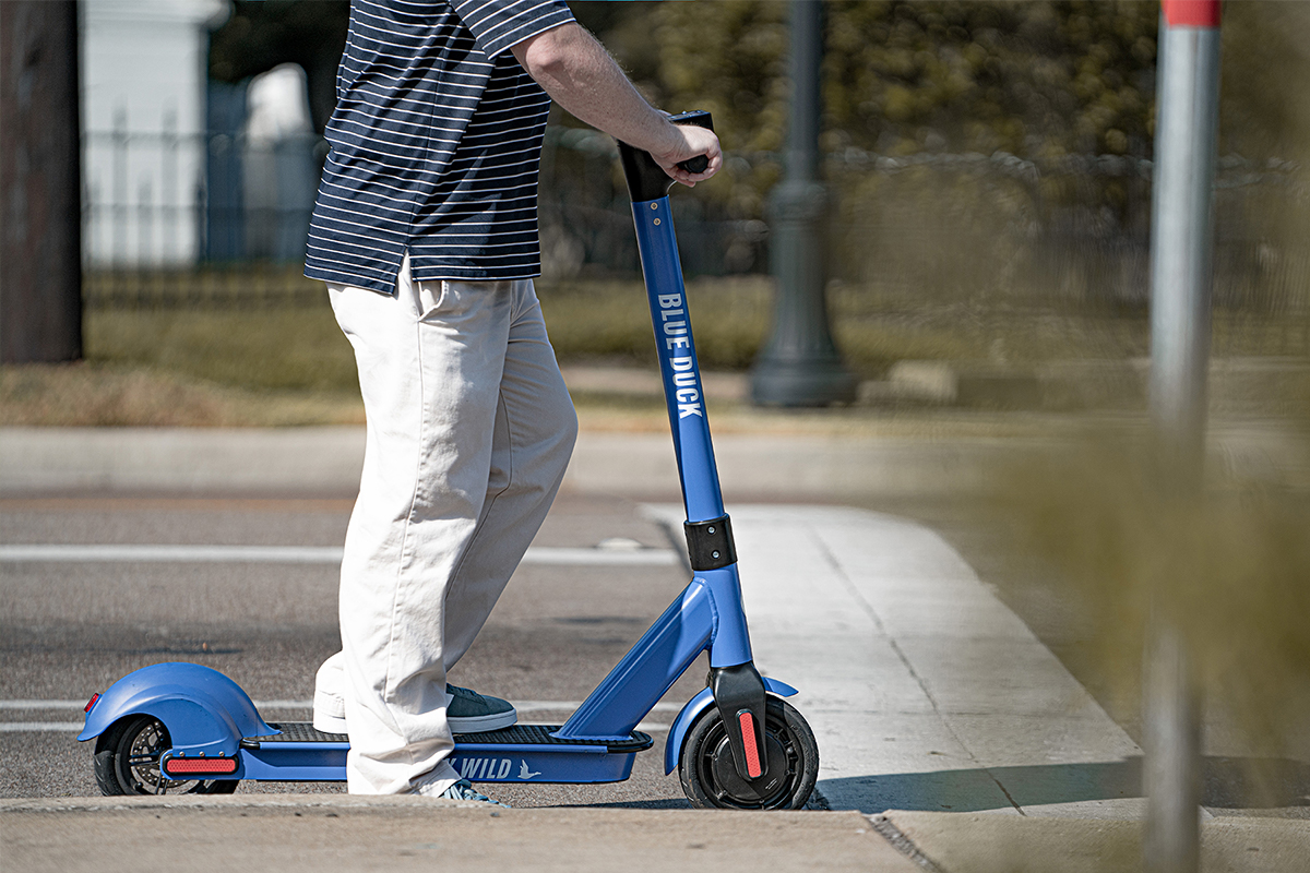 Man riding an electric scooter
