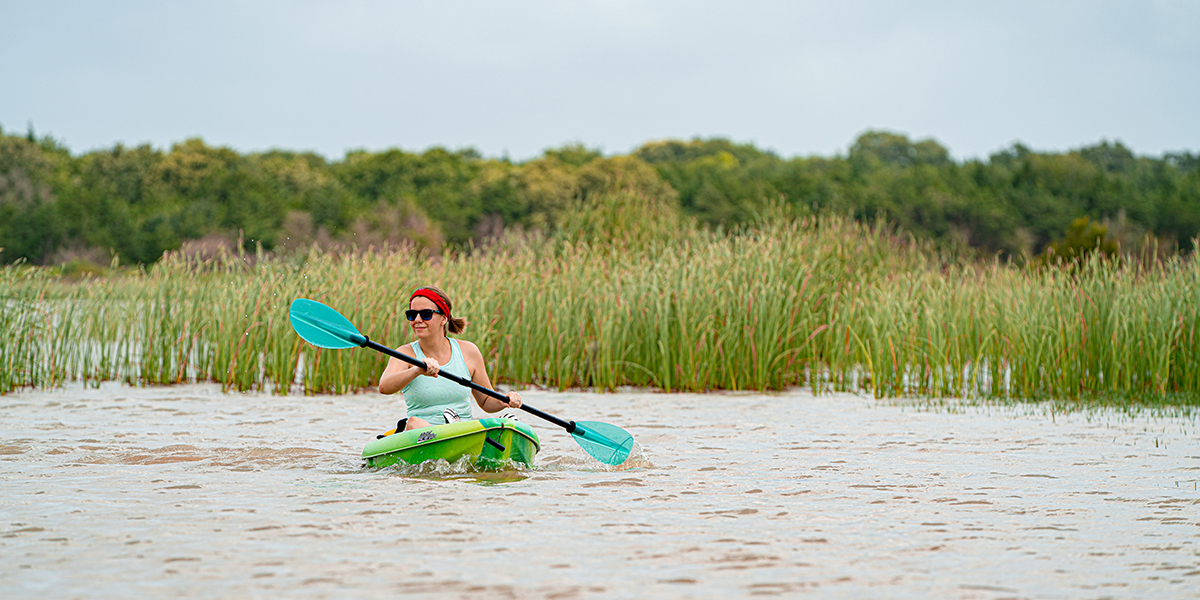 Woman kayaking in a lake