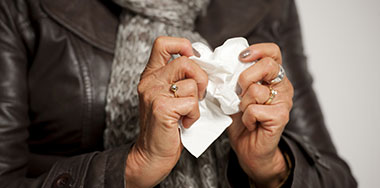 picture from CDC of woman holding tissue