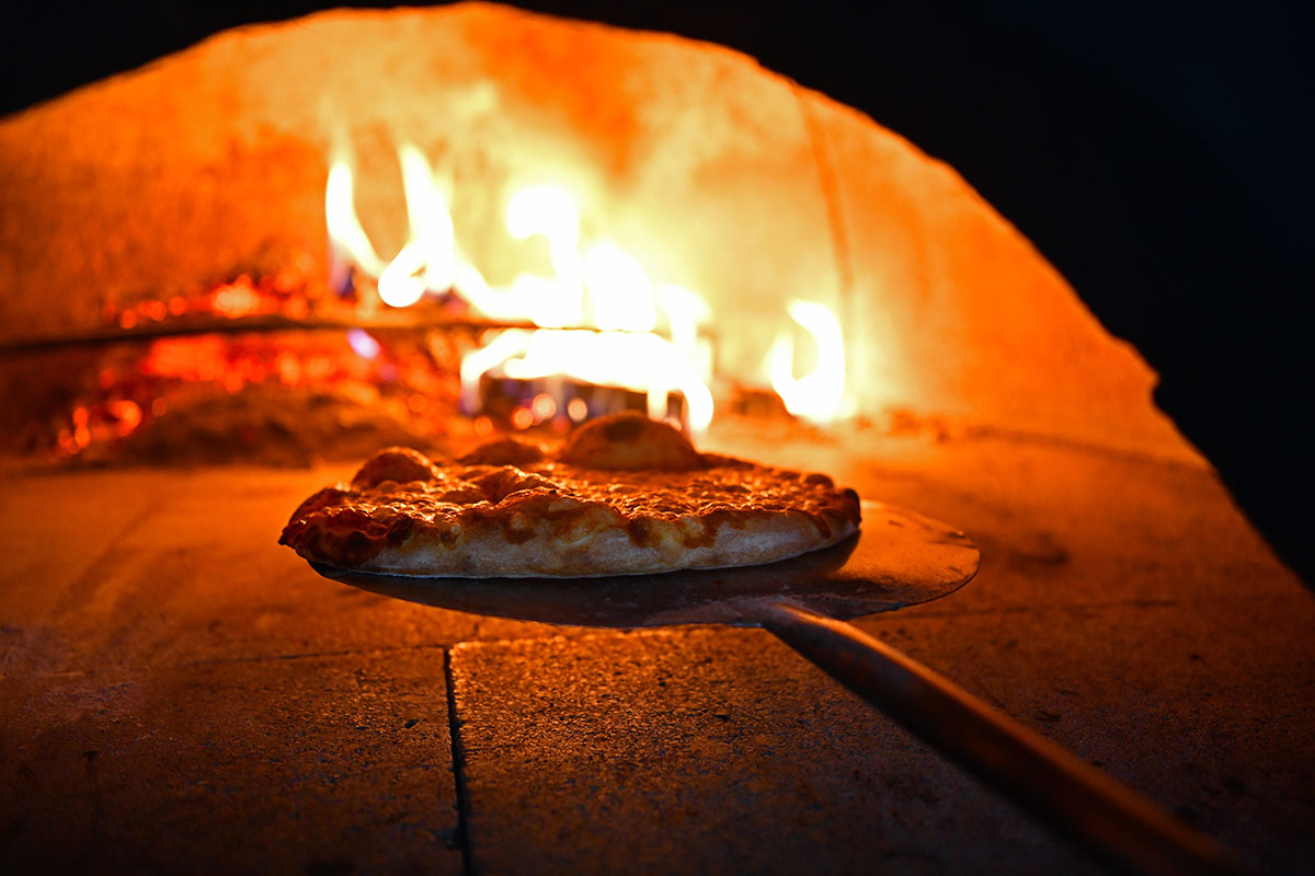 pizza in wood-fired pizza oven