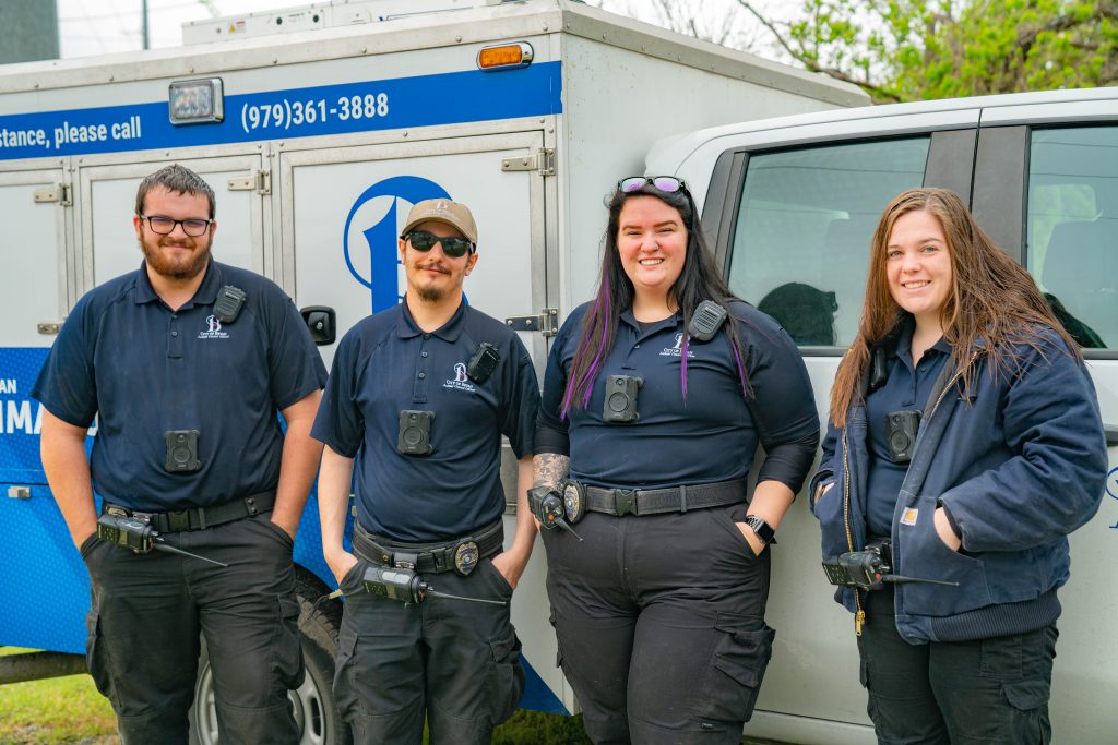 All four Animal Control Officers next to the Animal Control truck.