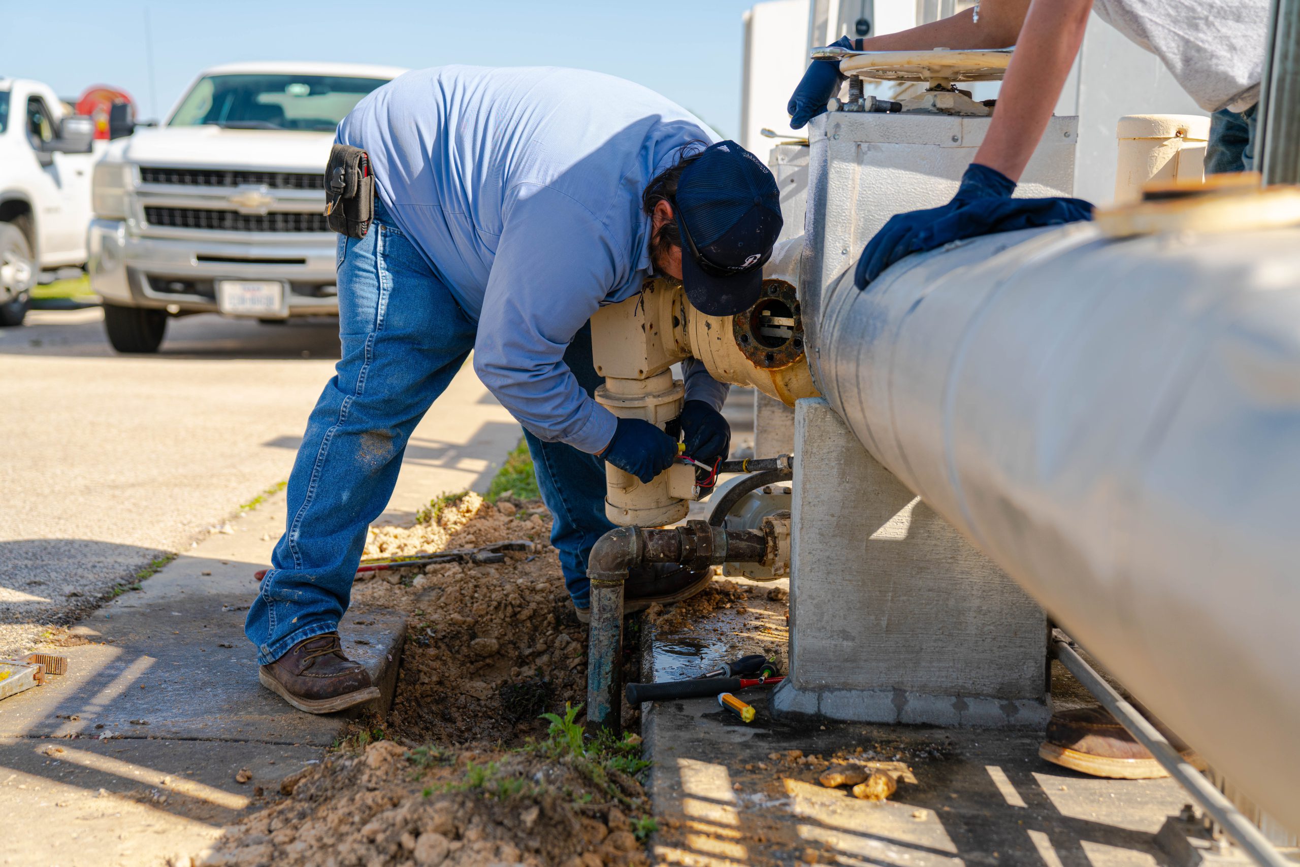 Wastewater workers fixing a leak.