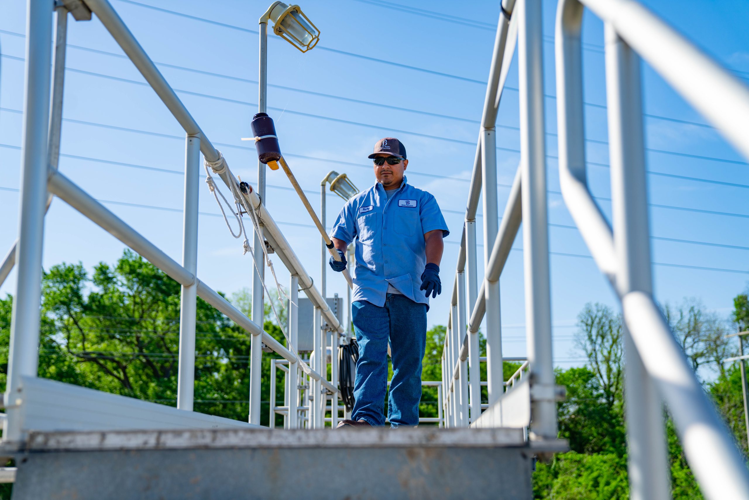 Wastewater worker testing sludge.