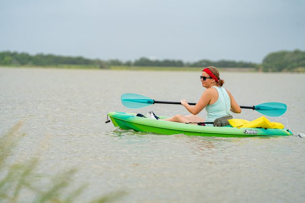 Woman kayaking at Lake Bryan.