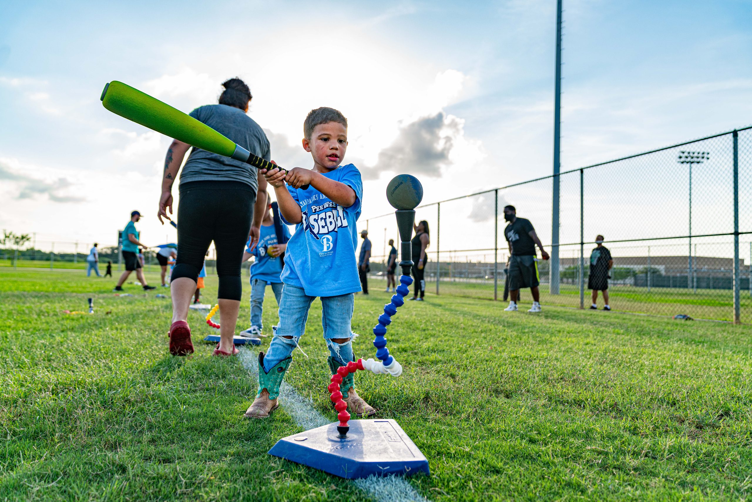 Photo of child paying tee-ball