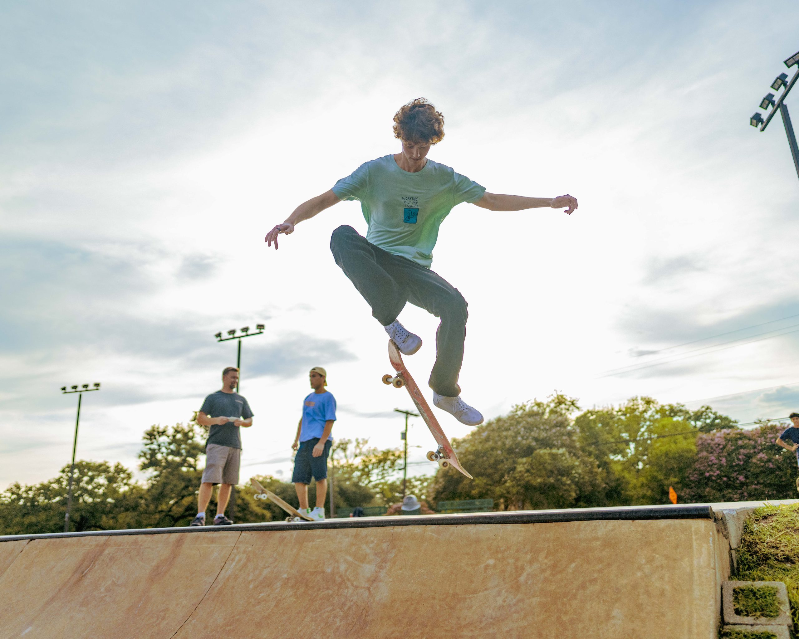 Photo of skateboarder doing a trick mid-air