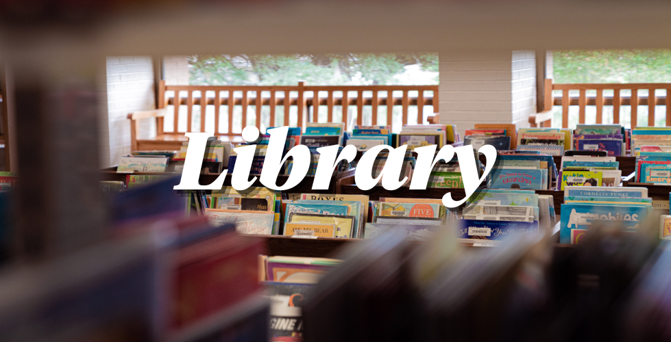 photo of bookshelves with title library