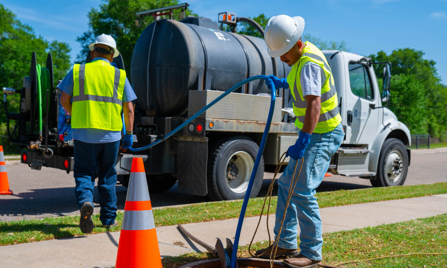 Water Department workers cleaning pipes