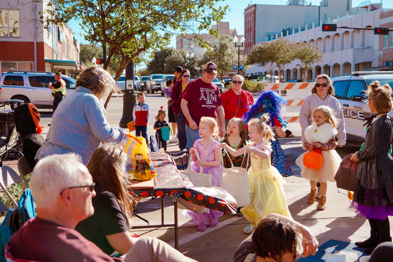 Photo of trick or treaters downtown.