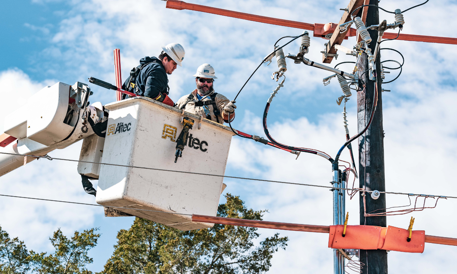 BTU linemen working in a bucket truck