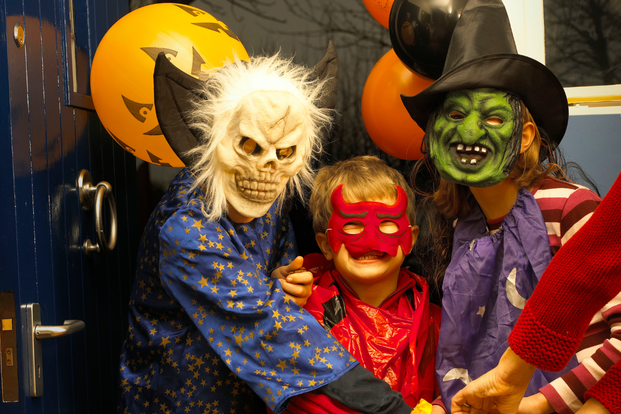 Kids wearing scary Halloween masks