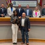 Bea Saba receiving an award at City Council Meeting.