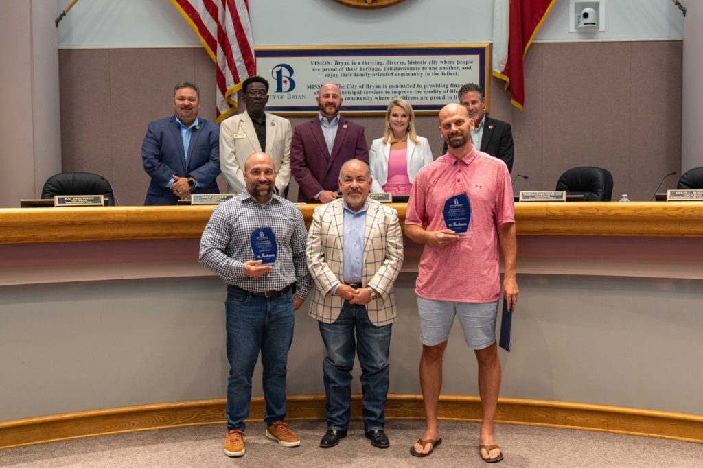 Photo of Bryan City Council with Bryan residents Jason Allen and Adam Richardson
