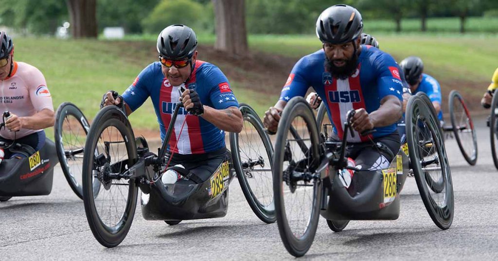 Two members of U.S. Cycling Paracycling team race in the UCI road race in Huntsville, Alabama in 2023.