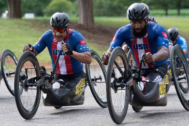 Two members of U.S. Cycling Paracycling team race in the UCI road race in Huntsville, Alabama in 2023.