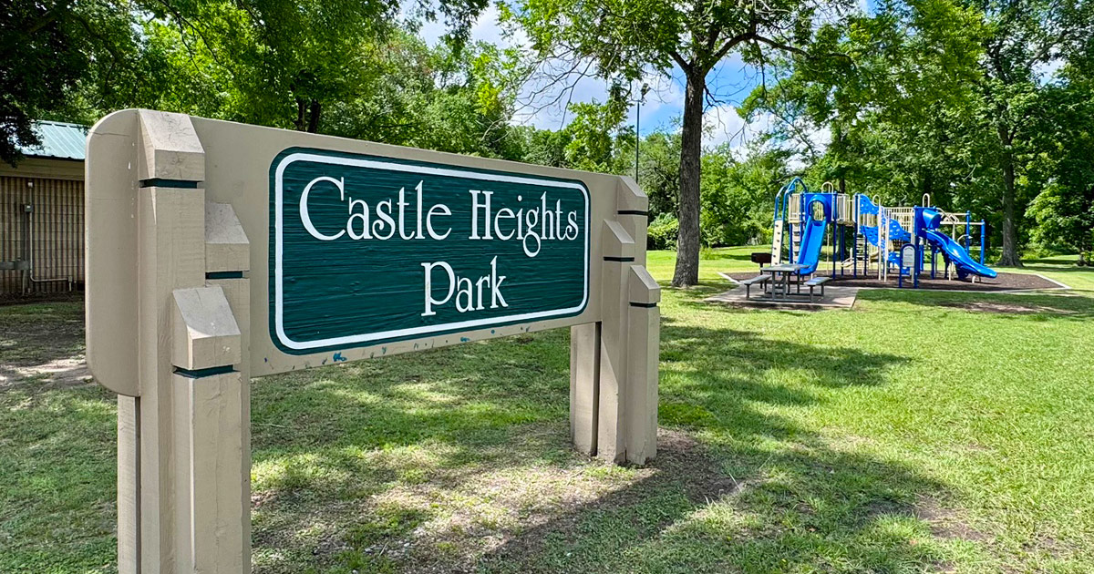 Castle Heights Park sign with park in the background