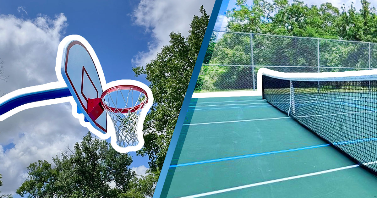 new basketball goal next to a newly surfaced tennis court outlined in bold white